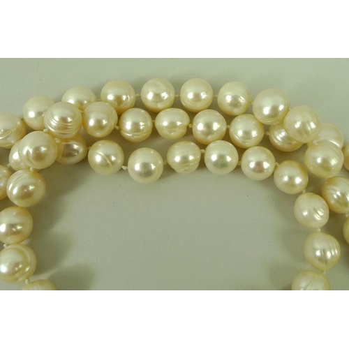 814 - A string of one hundred and twenty Chinese ringed pearls, pearls each approximately 10mm diameter, 1... 