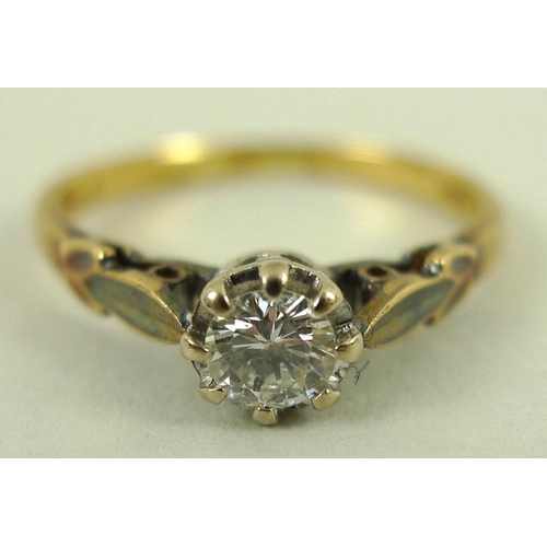 819 - A 18ct gold and diamond solitaire ring, platinum claw set, stylised leaf shoulders, approx 0.3ct, ma... 