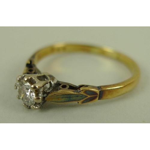 819 - A 18ct gold and diamond solitaire ring, platinum claw set, stylised leaf shoulders, approx 0.3ct, ma... 