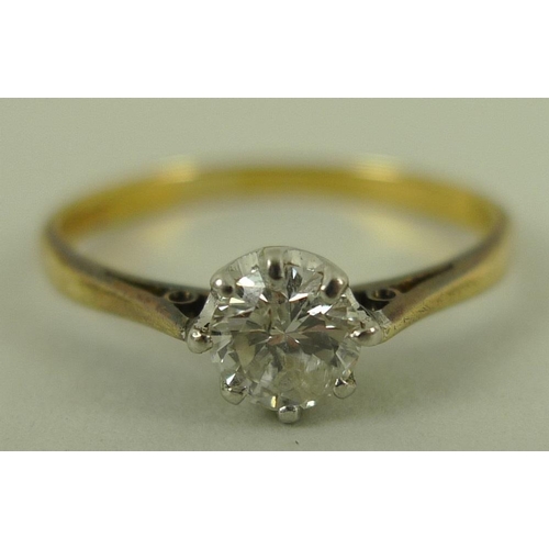 827 - A gold and diamond solitaire ring, platinum claw set, approx 0.4ct, marks rubbed, size Q 1/2, 2.3g.