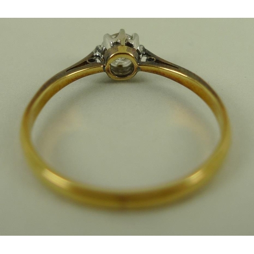 827 - A gold and diamond solitaire ring, platinum claw set, approx 0.4ct, marks rubbed, size Q 1/2, 2.3g.