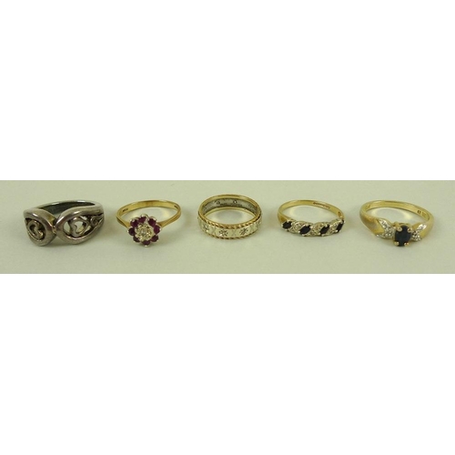 831 - A group of three 9ct gold rings, comprising a diamond and sapphire ring, a ruby and diamond ring, bo... 