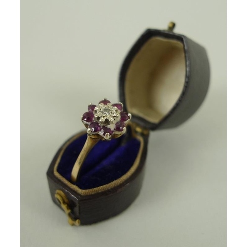 831 - A group of three 9ct gold rings, comprising a diamond and sapphire ring, a ruby and diamond ring, bo... 