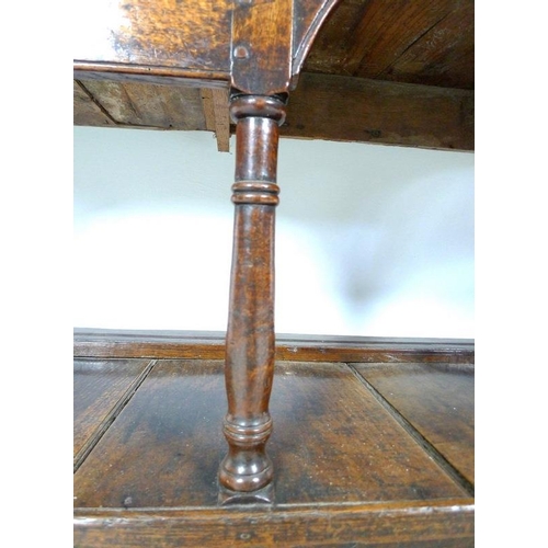 927 - A Georgian oak sideboard, later two shelf plate rack with trefoil detailing to the corners, the base... 