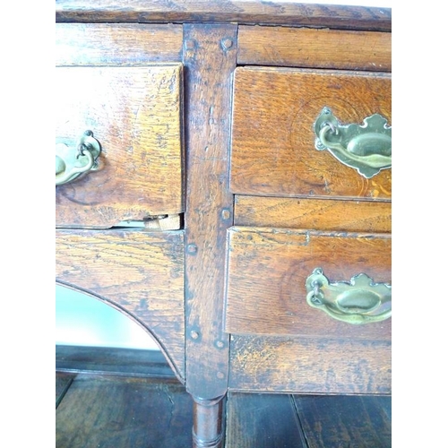 927 - A Georgian oak sideboard, later two shelf plate rack with trefoil detailing to the corners, the base... 