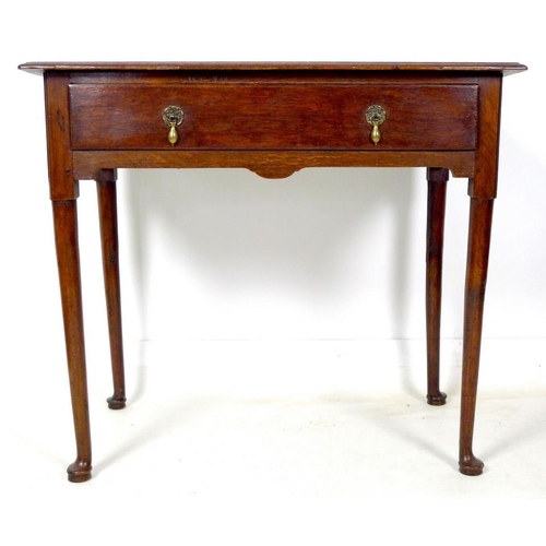 929 - A George I oak lowboy, with single drawer, brass drop handles, raised on turned and tapering legs wi... 