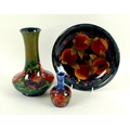 A Moorcroft Poppy pattern vase, green ground, base marked Moorcroft, Potter to HM The Queen, Made in... 