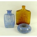 A group of three art glass vases, comprising an Italian slab sided bottle vase of amber glass in a m... 