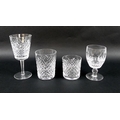 A suite of Waterford cut glass tableware, comprising six wine glasses, 12cm high, nine wine goblets,... 