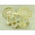 A selection of Belleek ceramics, comprising two plates, four vases of varying size and form, a tea l... 