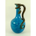 A porcelain ewer, possibly Chinese, of baluster form with applied salamander forming the handle, the... 