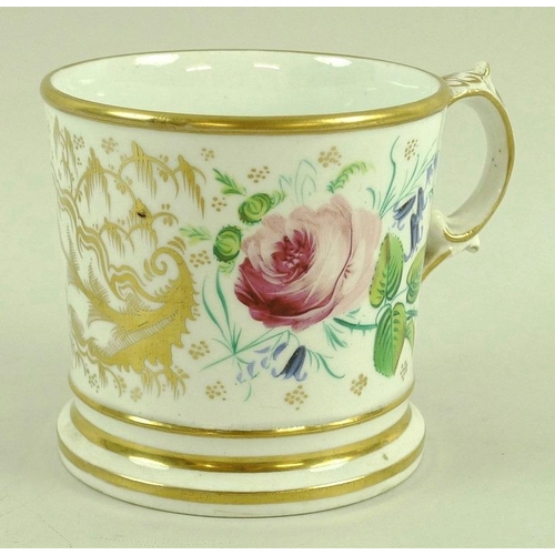 564 - A porcelain tankard, probably Coalport, 19th century, decorated with floral sprays and gilded highli... 