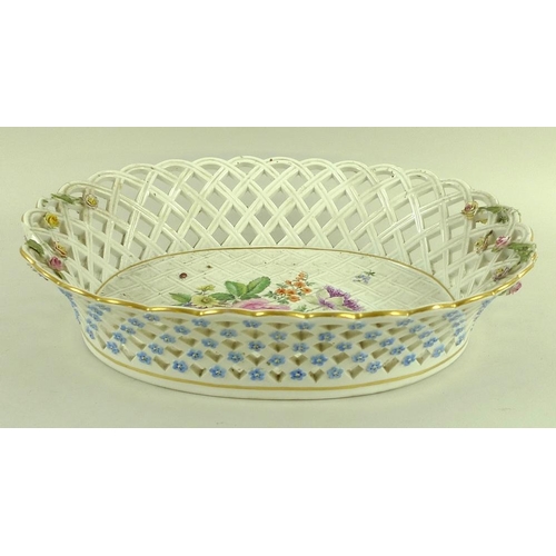 567 - A Meissen porcelain basket, 19th century, of oval form with lattice moulding and piercing, externall... 