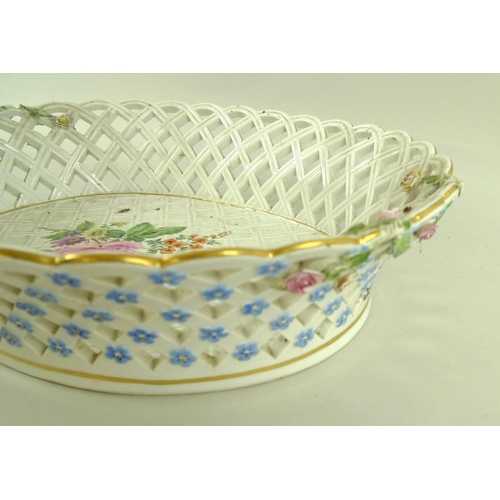 567 - A Meissen porcelain basket, 19th century, of oval form with lattice moulding and piercing, externall... 