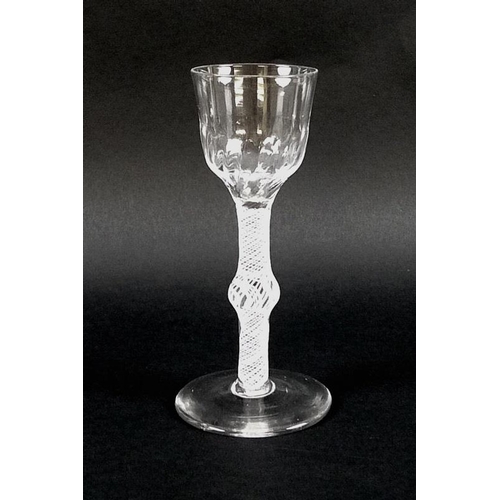 569 - An 18th century opaque air-twist stem and knop drinking glass with soft fluted bucket bowl, English,... 