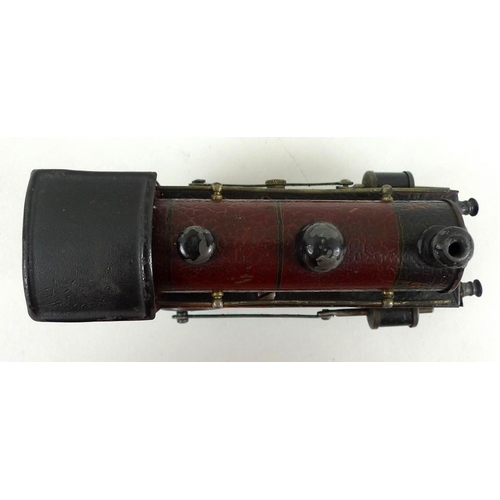 699 - A Marklin O gauge tin plate 0-4-0 tank loco, early 20th century, electric 3-rail, maroon with black ... 