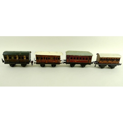 700 - A group of O gauge tinplate coaches, early 20th century, comprising two Marklin passenger coaches, w... 