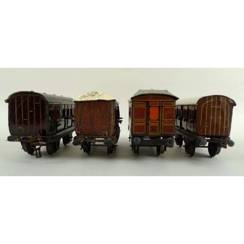 700 - A group of O gauge tinplate coaches, early 20th century, comprising two Marklin passenger coaches, w... 