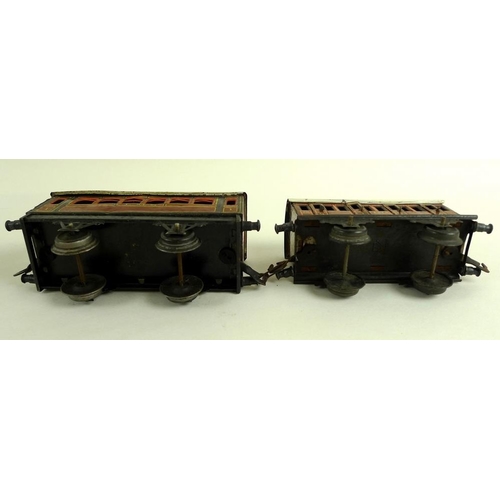 700 - A group of O gauge tinplate coaches, early 20th century, comprising two Marklin passenger coaches, w... 