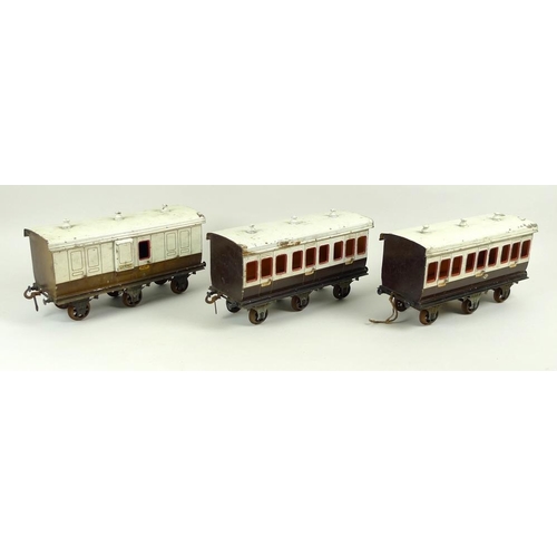 710 - A group of three large scale 2.75 inch coaches, circa 1930, comprising two First Class passenger coa... 