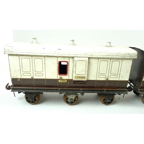 710 - A group of three large scale 2.75 inch coaches, circa 1930, comprising two First Class passenger coa... 