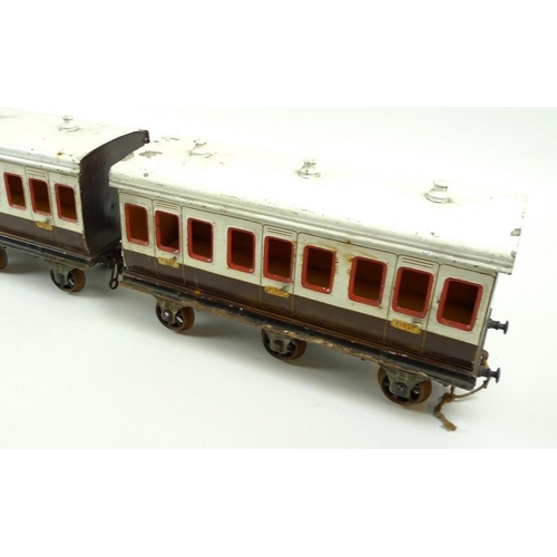 710 - A group of three large scale 2.75 inch coaches, circa 1930, comprising two First Class passenger coa... 