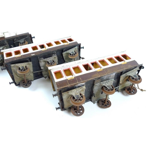 710 - A group of three large scale 2.75 inch coaches, circa 1930, comprising two First Class passenger coa... 