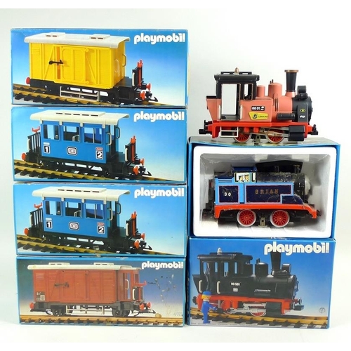 711 - A group of vintage Playmobil model railway, comprising three locos, two passenger coaches, and two g... 