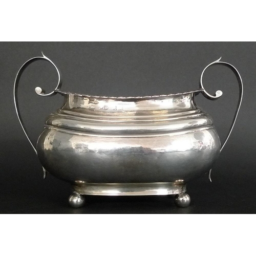 814 - An usually large Georgian silver sucrier, the boat shaped body with ribbed shoulders, lappet and bea... 