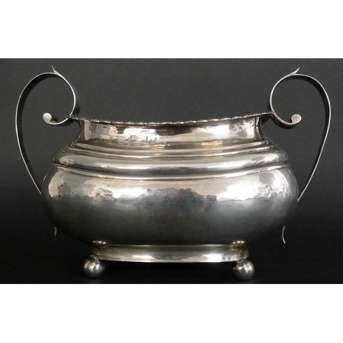 814 - An usually large Georgian silver sucrier, the boat shaped body with ribbed shoulders, lappet and bea... 