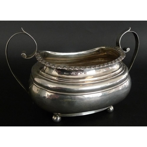 814 - An usually large Georgian silver sucrier, the boat shaped body with ribbed shoulders, lappet and bea... 