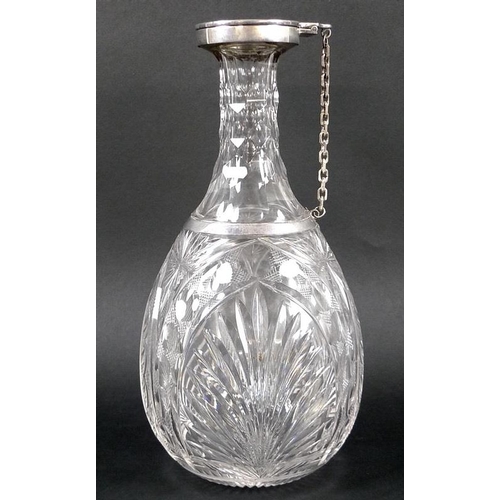 815 - An George V silver mounted cut glass claret jug, with oval-shaped cut-glass body, silver 'trap' lid ... 