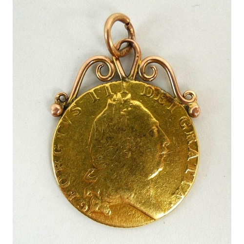 832 - A George III gold guinea, dated 1790, with later attached scrolling pendant loops, 9.3g.