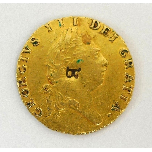 833 - A George III gold half guinea, dated 1796, overstruck, 4.3g.