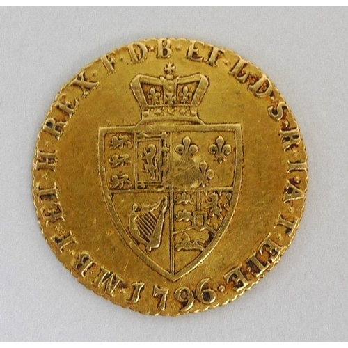 833 - A George III gold half guinea, dated 1796, overstruck, 4.3g.