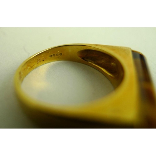 837 - An 18ct gold ring set with a cylinder cut tiger's eye, size 'L', 6.4g, together with a 14ct gold tri... 