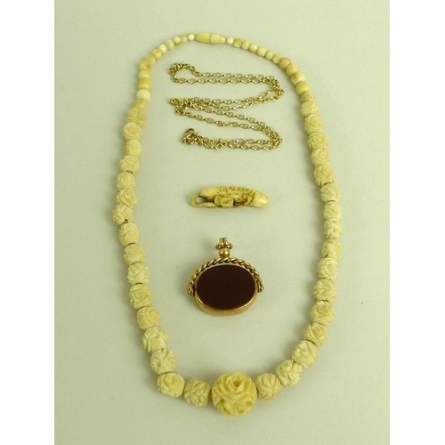 840 - A group of jewellery, comprising a 9ct gold chain, 5.7g, a Japanese bone carved pendant of a cucumbe... 