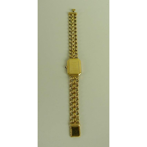 841 - A lady's gold plated Chanel watch, circa 1990, with black rectangular face with canted corners, gold... 