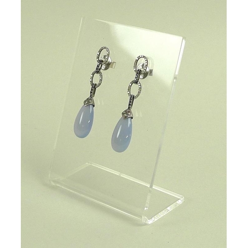 844 - A pair of chalcedony, sapphire and diamond earrings, the jade drops with diamond set surmounts suspe... 