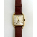 A Bulova gentleman's' wristwatch, circa 1940, with square champagne face, gold Arabic numerals, a se... 