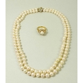 A double strand of 128 pearls, set on a 15ct gold clasp with pave  set diamonds, 47cm long, together... 