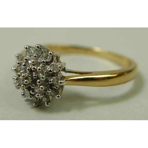 860 - A 9ct gold and diamond dress ring, with starburst illusion set diamonds, size P, total weight 1.7g.