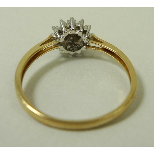 860 - A 9ct gold and diamond dress ring, with starburst illusion set diamonds, size P, total weight 1.7g.