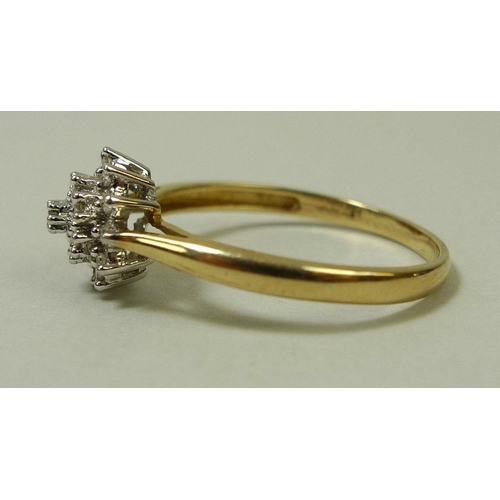 860 - A 9ct gold and diamond dress ring, with starburst illusion set diamonds, size P, total weight 1.7g.