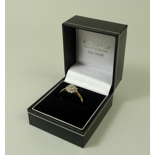 860 - A 9ct gold and diamond dress ring, with starburst illusion set diamonds, size P, total weight 1.7g.