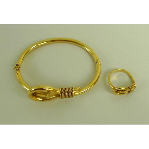 866 - An 18ct gold bangle and matching ring, size L, modelled as a slip-knot, by Greek jewellery designer ... 