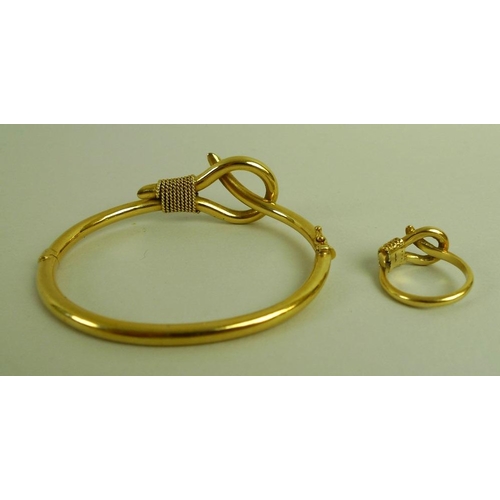 866 - An 18ct gold bangle and matching ring, size L, modelled as a slip-knot, by Greek jewellery designer ... 