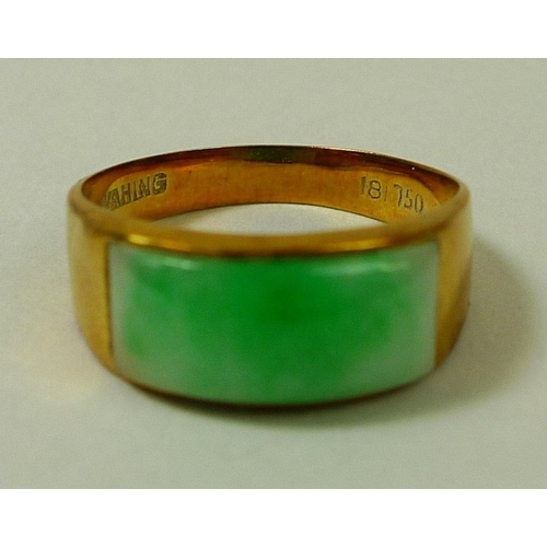 873 - An 18ct gold ring set with green apple jade, size M/N, 3.6g, together with a pair of apple jade unse... 