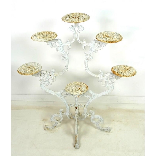 895 - A cast iron Coalbrookdale style candelabra jardiniere stand, late 20th century, with six circular st... 