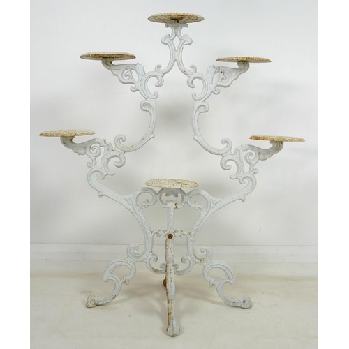 895 - A cast iron Coalbrookdale style candelabra jardiniere stand, late 20th century, with six circular st... 